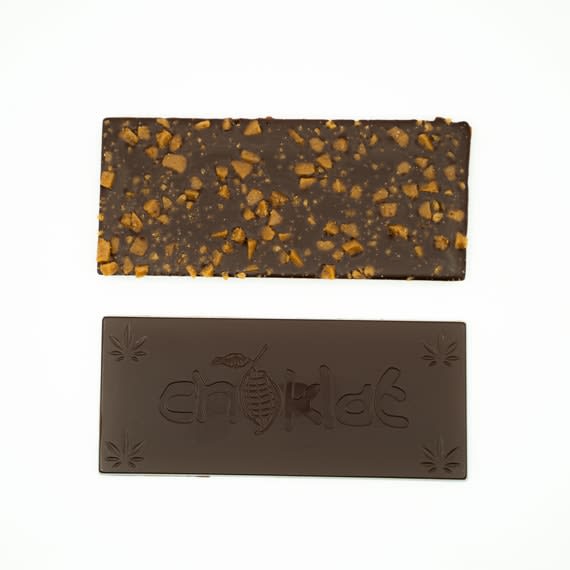 Description Phat420 Dark Chocolate with Skor Bits is a single serving 30g chocolate bar that has been infused with 10mg of THC distillate. The flavour is tasteless and odorless. Crafted using only the highest quality and best tasting ingredients to deliver a perfect taste every time. Formulated specifically for the chocolate edibles market. Our unique processes and high purity distillates deliver a safe and evenly infused experience.
